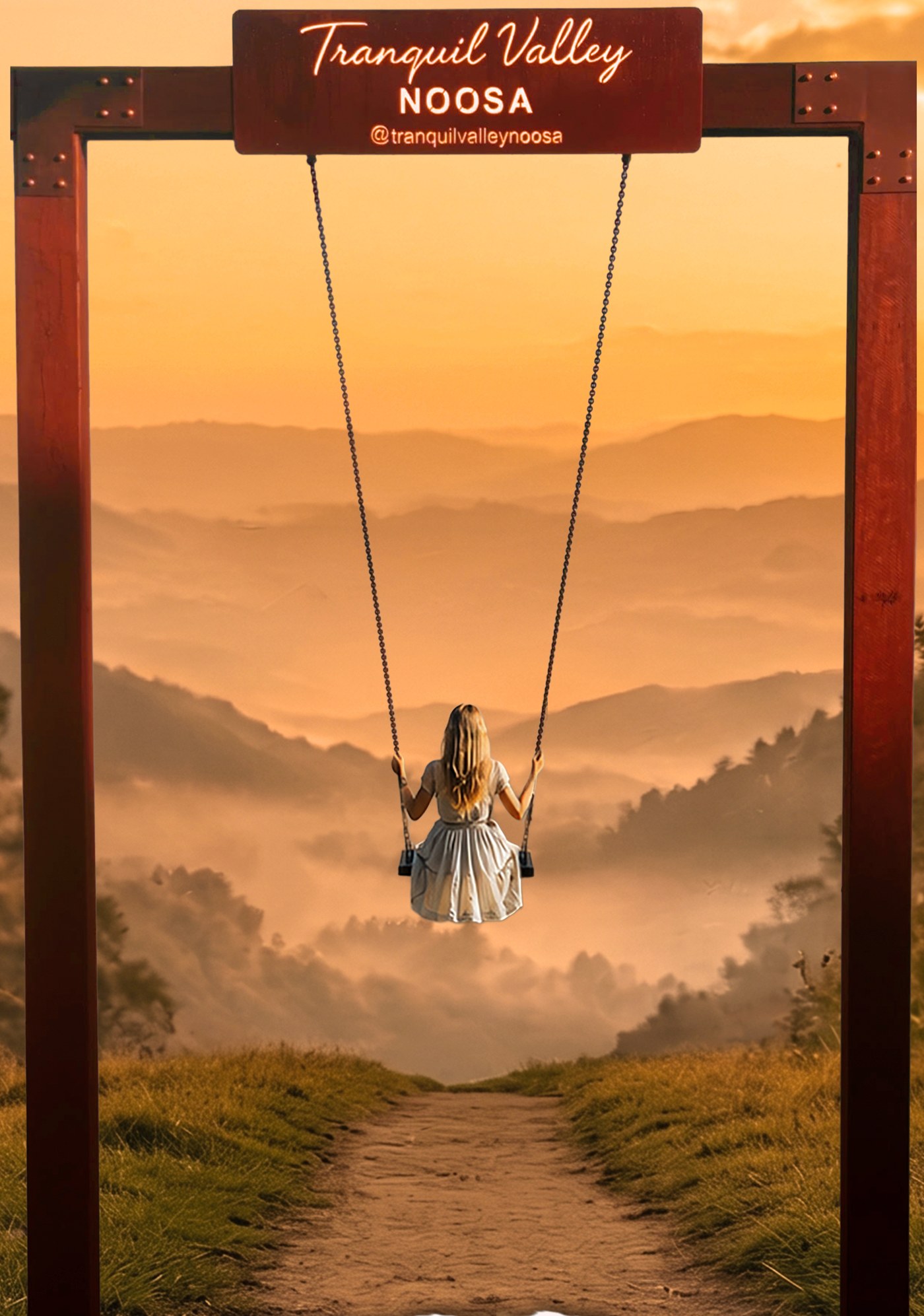 The giant swing at Tranquil Valley Noosa overlooking a misty hinterland valley at sunset